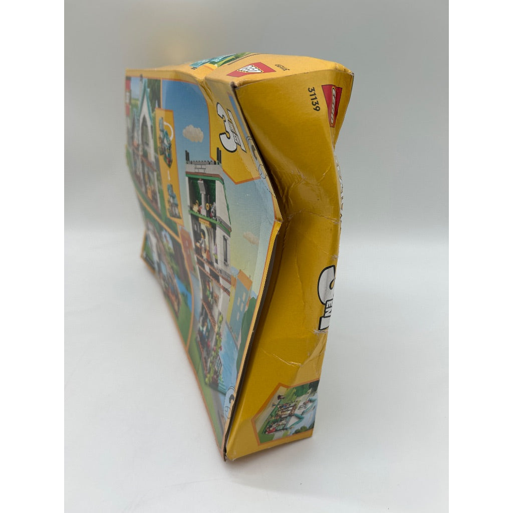 LEGO Creator 3 in 1 Cozy House Building Kit  Rebuild Into 3 Different Houses  Includes Family Minifigures and Accessories  DIY Building Toy Ideas for