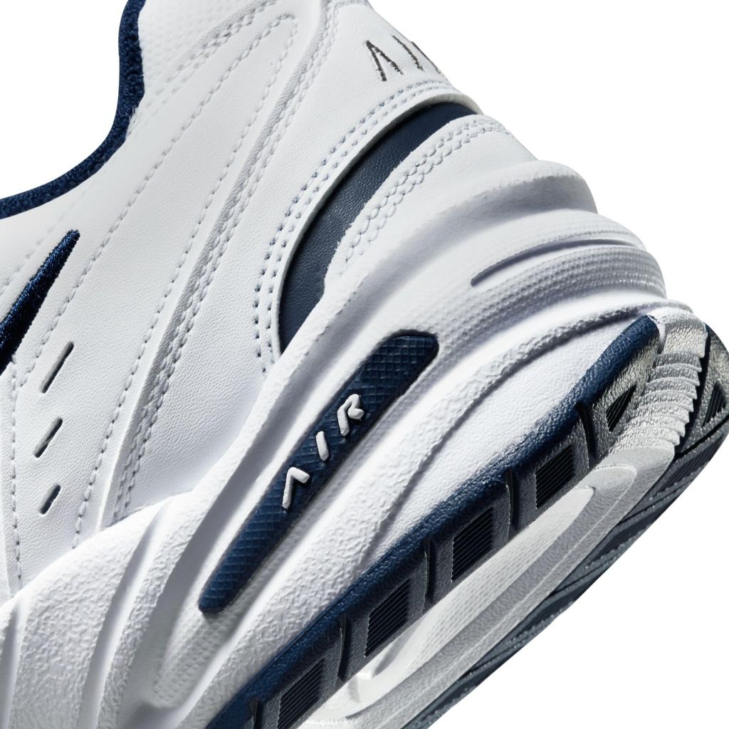 SZ 9 WD, Nike Men's Air Monarch Iv Sneaker, White Metallic Silver 102